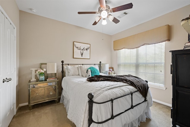9135 Solvista Pass Ln, Houston, TX 77070 - bedroom featuring light carpet, multiple windows, and baseboards