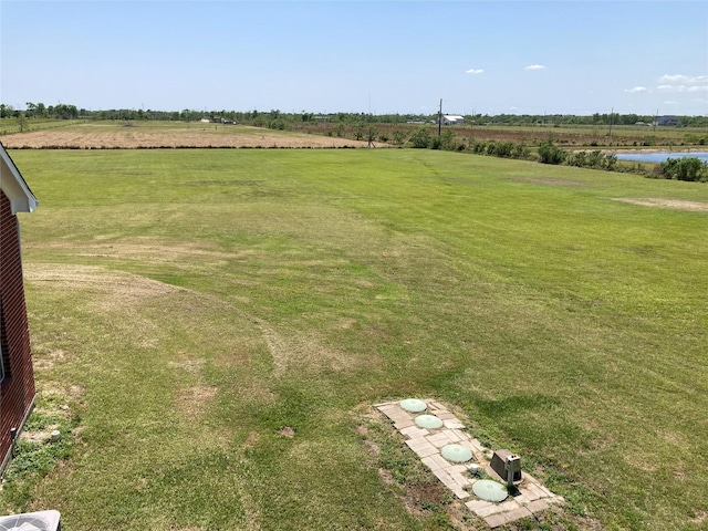 2709 Flores Bayou Bridge Rd, Angleton, TX 77515 - view of green lawn with a rural view