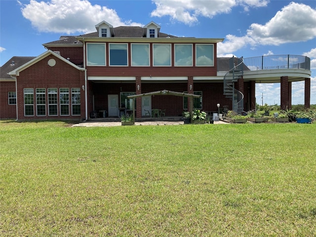 2709 Flores Bayou Bridge Rd, Angleton, TX 77515 - rear view of house with a patio area, stairway, a lawn, and brick siding