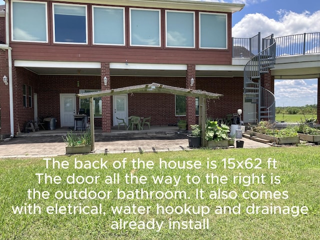 2709 Flores Bayou Bridge Rd, Angleton, TX 77515 - back of house featuring stairway, a patio area, a garden, and brick siding