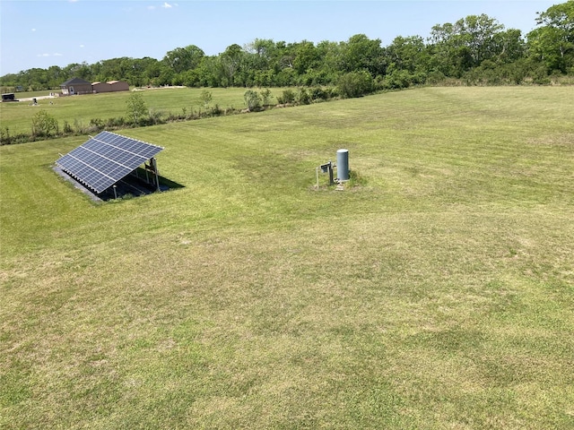 2709 Flores Bayou Bridge Rd, Angleton, TX 77515 - view of green lawn featuring a rural view