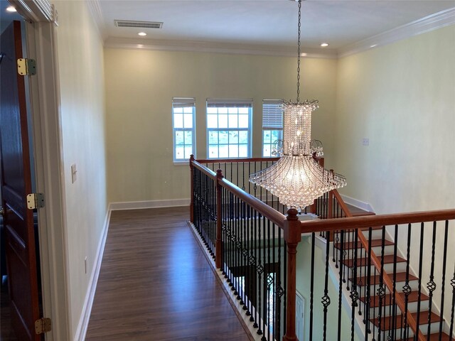 2709 Flores Bayou Bridge Rd, Angleton, TX 77515 - corridor featuring a chandelier, wood finished floors, crown molding, baseboards, and an upstairs landing