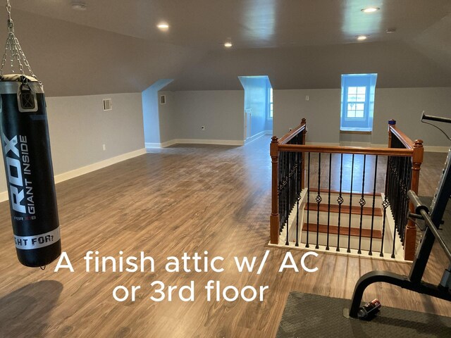 2709 Flores Bayou Bridge Rd, Angleton, TX 77515 - additional living space with vaulted ceiling, wood finished floors, baseboards, and recessed lighting