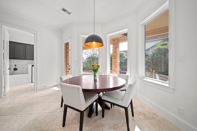 3 Amulet Oaks Pl, The Woodlands, TX 77382 - dining space with ornamental molding, light tile patterned floors, and baseboards
