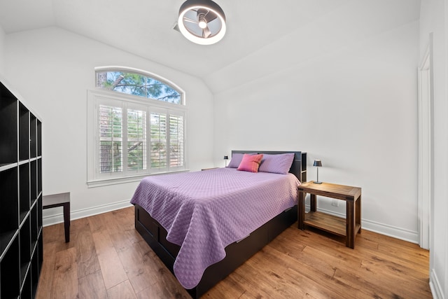 3 Amulet Oaks Pl, The Woodlands, TX 77382 - bedroom featuring vaulted ceiling, wood finished floors, and baseboards