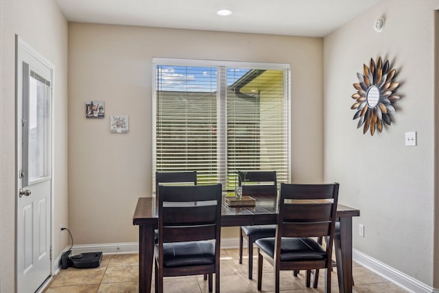 15314 Ashbrook Dove Ln, Cypress, TX 77429 - dining space featuring baseboards, light tile patterned floors, and recessed lighting