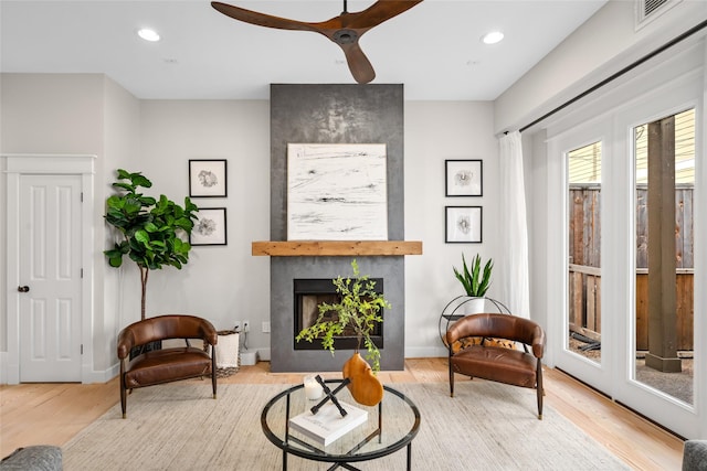 1728 Nicholson St, Houston, TX 77008 - living area featuring wood finished floors, a ceiling fan, a fireplace, recessed lighting, and baseboards