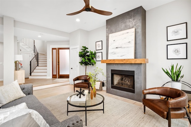 1728 Nicholson St, Houston, TX 77008 - living area with wood finished floors, a ceiling fan, stairway, a fireplace, and recessed lighting