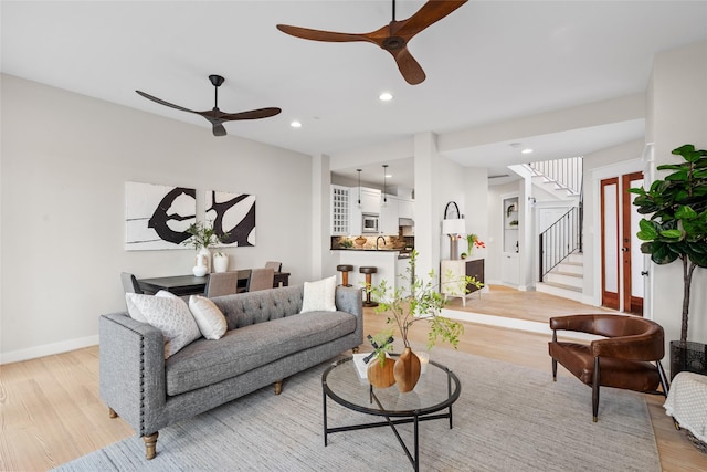 1728 Nicholson St, Houston, TX 77008 - living room with ceiling fan, light wood-type flooring, baseboards, stairway, and recessed lighting