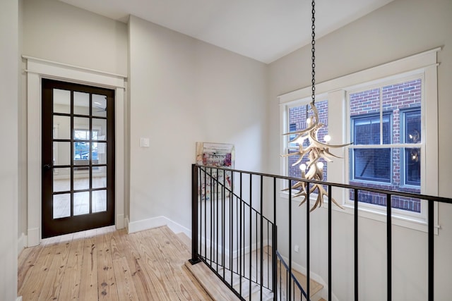 1728 Nicholson St, Houston, TX 77008 - entrance foyer featuring a chandelier, light wood-type flooring, and baseboards