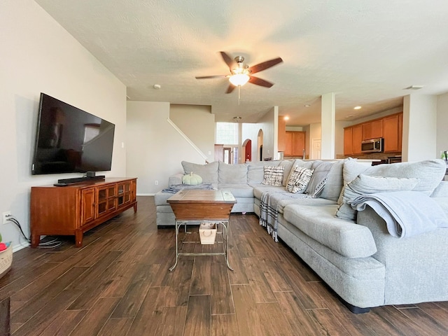 20223 Benton Springs Ln, Richmond, TX 77407 - living area with dark wood-style floors, ceiling fan, and stairway