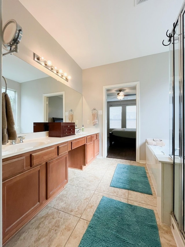 20223 Benton Springs Ln, Richmond, TX 77407 - ensuite bathroom with healthy amount of natural light, tile patterned flooring, a bath, and double vanity