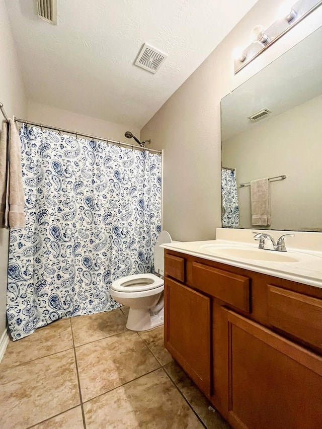 20223 Benton Springs Ln, Richmond, TX 77407 - bathroom featuring vanity, toilet, tile patterned flooring, and a shower with shower curtain