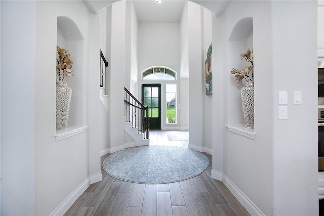 3207 Sweet Audrey Ln, Richmond, TX 77406 - foyer featuring dark wood finished floors, baseboards, stairs, and a towering ceiling