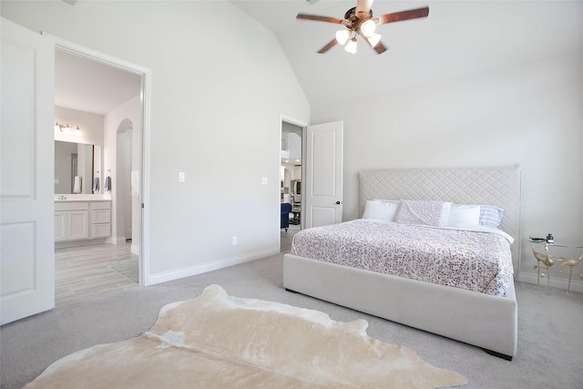 3207 Sweet Audrey Ln, Richmond, TX 77406 - carpeted bedroom featuring arched walkways, baseboards, ensuite bath, ceiling fan, and high vaulted ceiling