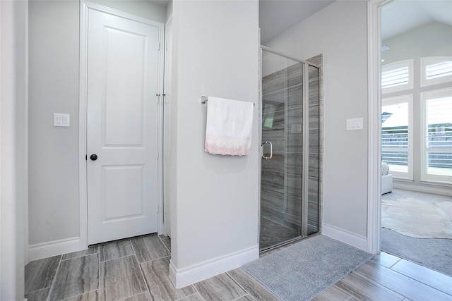 3207 Sweet Audrey Ln, Richmond, TX 77406 - full bathroom with wood finish floors, a stall shower, and baseboards