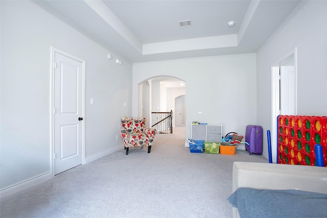 3207 Sweet Audrey Ln, Richmond, TX 77406 - sitting room featuring arched walkways, a raised ceiling, carpet, and baseboards