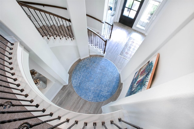 3207 Sweet Audrey Ln, Richmond, TX 77406 - staircase featuring a towering ceiling and wood finished floors