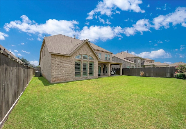 3207 Sweet Audrey Ln, Richmond, TX 77406 - back of property featuring brick siding, cooling unit, and roof with shingles