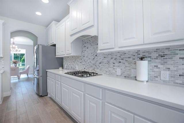 3207 Sweet Audrey Ln, Richmond, TX 77406 - kitchen featuring appliances with stainless steel finishes, white cabinetry, a chandelier, light countertops, and recessed lighting