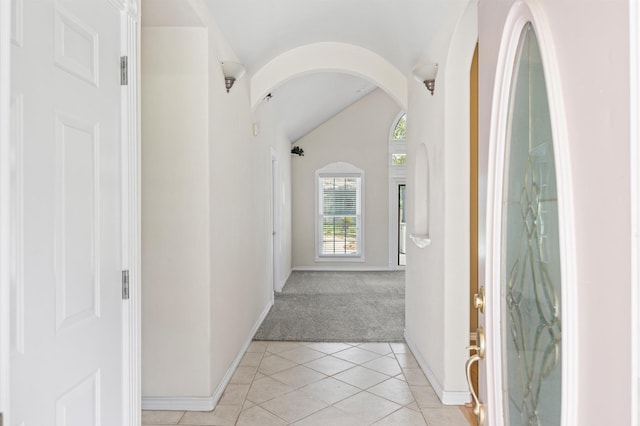25187 Hill And Dale Ave, Splendora, TX 77372 - hall with light colored carpet, light tile patterned floors, lofted ceiling, and baseboards