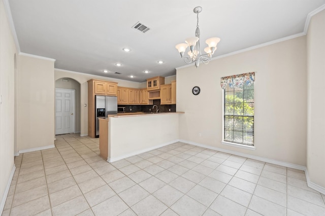25187 Hill And Dale Ave, Splendora, TX 77372 - kitchen featuring a chandelier, crown molding, stainless steel refrigerator with ice dispenser, arched walkways, and baseboards