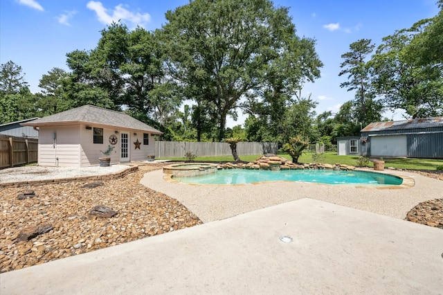 25187 Hill And Dale Ave, Splendora, TX 77372 - view of pool featuring an outdoor structure, a fenced backyard, a patio area, and a pool with connected hot tub