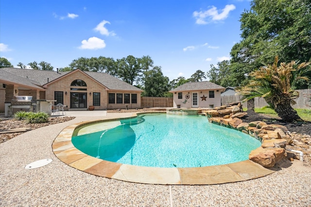 25187 Hill And Dale Ave, Splendora, TX 77372 - view of swimming pool featuring a fenced backyard, a patio, area for grilling, an outdoor structure, and a pool with connected hot tub