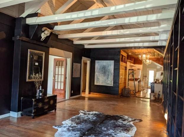 4204 Stanford St, Houston, TX 77006 - living area featuring a chandelier, wood finished floors, and wooden walls