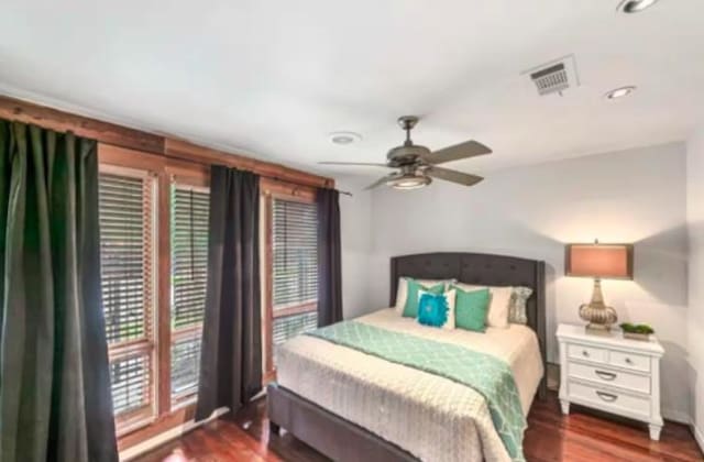 4204 Stanford St, Houston, TX 77006 - bedroom featuring wood finished floors, baseboards, and ceiling fan