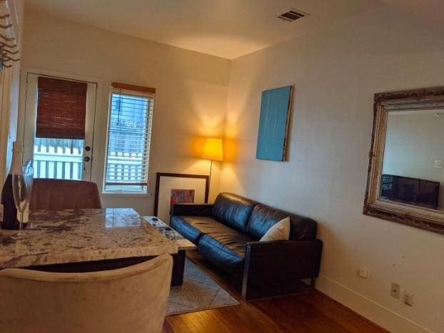 4204 Stanford St, Houston, TX 77006 - living room featuring wood finished floors and baseboards