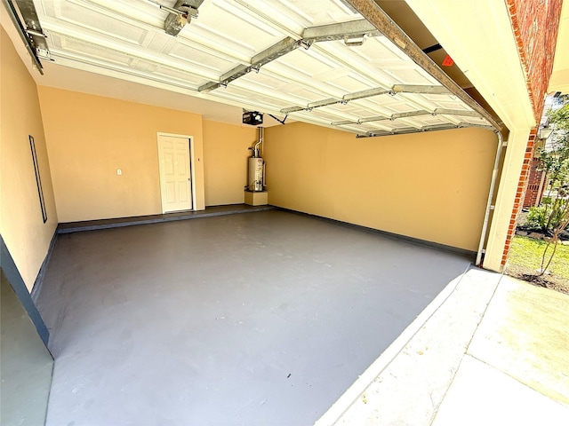 19646 Ballina Meadows Dr, Katy, TX 77449 - garage with gas water heater, a garage door opener, and baseboards