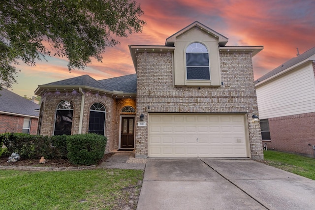 3010 Meadow Bay Dr, Dickinson, TX 77539 - view of front of house with concrete driveway, a garage, brick siding, and a shingled roof