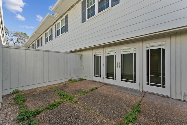425 Bendwood Dr Unit 49, Houston, TX 77024 - back of property featuring french doors, fence, and a patio
