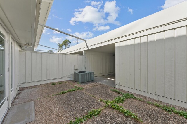 425 Bendwood Dr Unit 49, Houston, TX 77024 - view of side of property with cooling unit and a patio