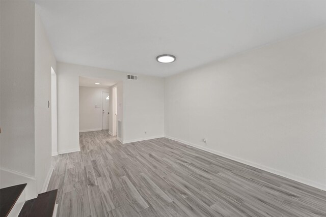 425 Bendwood Dr Unit 49, Houston, TX 77024 - empty room featuring light wood-type flooring and baseboards