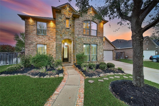 12119 Bayou Junction Rd, Cypress, TX 77433 - view of front facade with driveway, stone siding, brick siding, and a garage