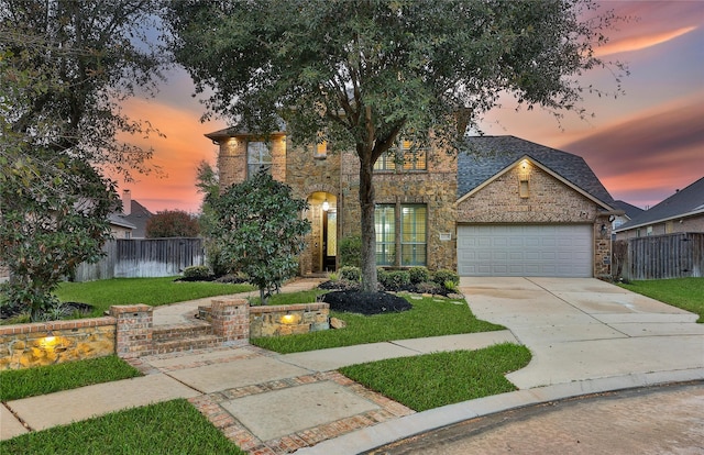 12119 Bayou Junction Rd, Cypress, TX 77433 - view of front facade featuring an attached garage, concrete driveway, and stone siding