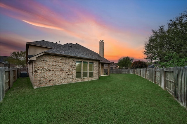 12119 Bayou Junction Rd, Cypress, TX 77433 - back of property featuring brick siding, a chimney, and a shingled roof