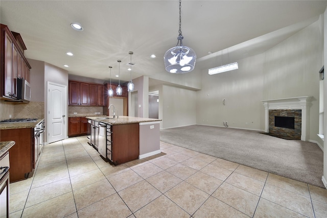 12119 Bayou Junction Rd, Cypress, TX 77433 - kitchen featuring light colored carpet, a sink, light tile patterned flooring, recessed lighting, and open floor plan