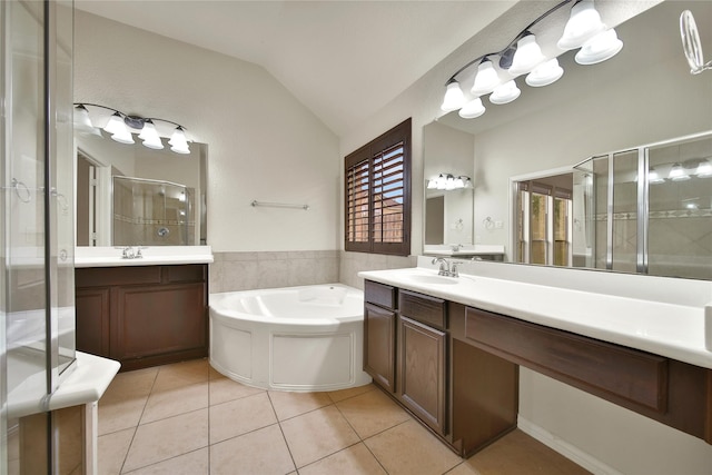 12119 Bayou Junction Rd, Cypress, TX 77433 - full bath featuring a stall shower, lofted ceiling, tile patterned floors, a garden tub, and two vanities