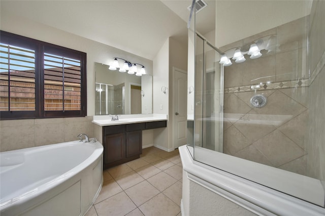12119 Bayou Junction Rd, Cypress, TX 77433 - bathroom featuring a shower stall, tile patterned flooring, a bath, vanity, and vaulted ceiling