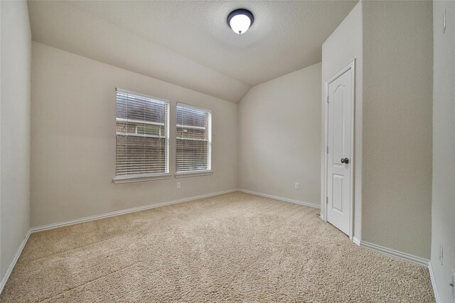12119 Bayou Junction Rd, Cypress, TX 77433 - carpeted spare room with vaulted ceiling and baseboards