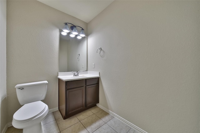 12119 Bayou Junction Rd, Cypress, TX 77433 - half bathroom with vanity, toilet, tile patterned flooring, and baseboards