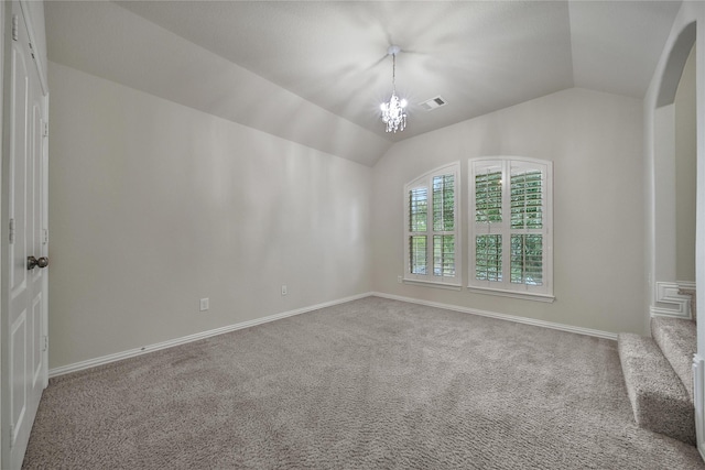 12119 Bayou Junction Rd, Cypress, TX 77433 - unfurnished room with vaulted ceiling, carpet, baseboards, a chandelier, and arched walkways