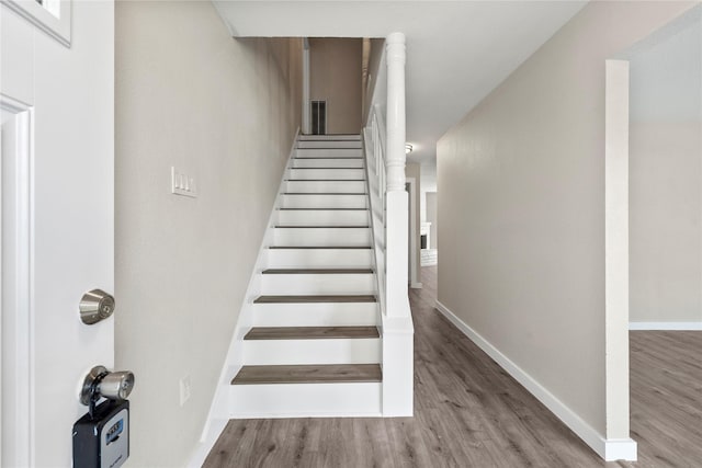 9110 Vickijohn Dr, Houston, TX 77031 - stairs featuring wood finished floors and baseboards