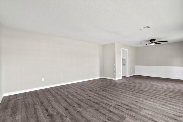 9110 Vickijohn Dr, Houston, TX 77031 - spare room featuring dark wood finished floors, a ceiling fan, and baseboards