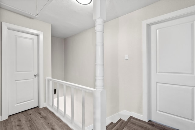 9110 Vickijohn Dr, Houston, TX 77031 - corridor featuring wood finished floors, attic access, an upstairs landing, and baseboards