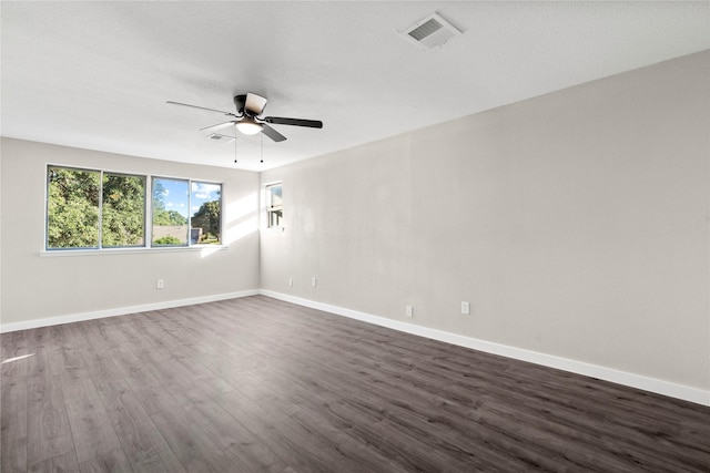9110 Vickijohn Dr, Houston, TX 77031 - spare room featuring dark wood finished floors, a ceiling fan, and baseboards