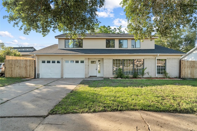 9110 Vickijohn Dr, Houston, TX 77031 - traditional home featuring an attached garage, concrete driveway, brick siding, and roof with shingles